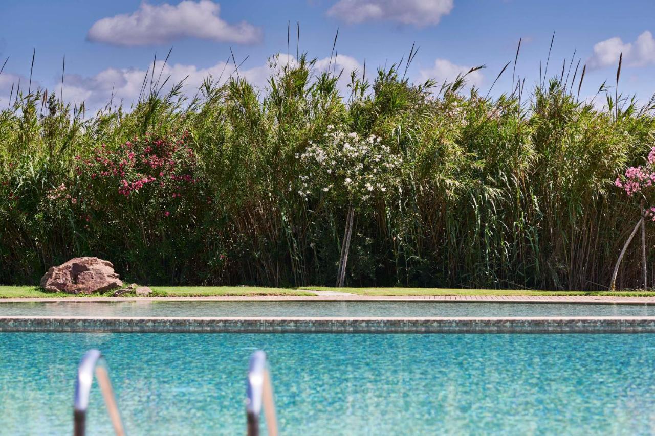 Baia Di Chia Resort Sardinia, Curio Collection By Hilton Esterno foto