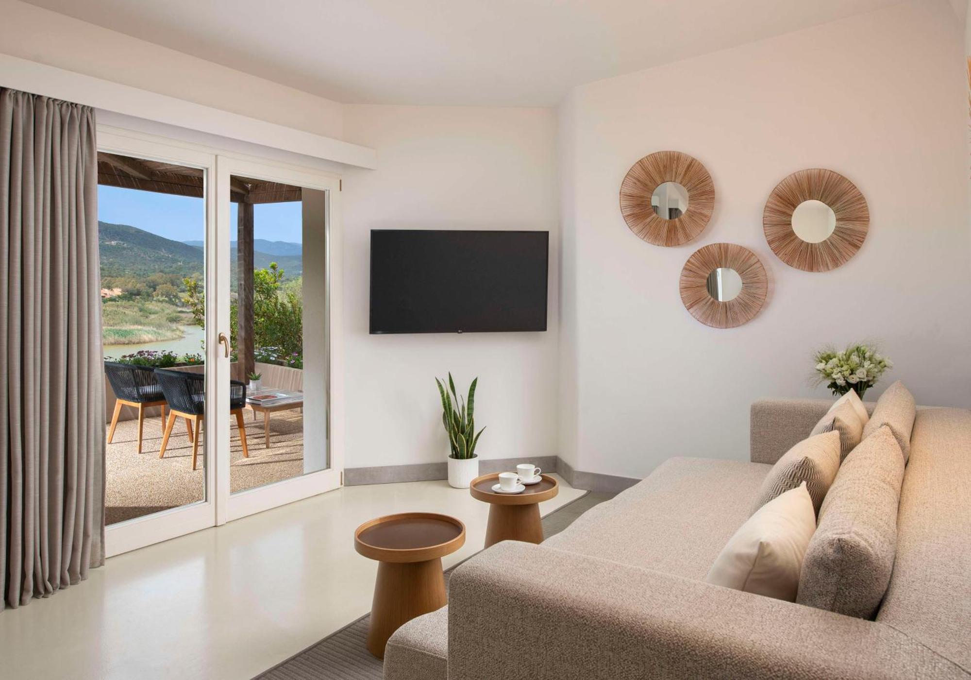Baia Di Chia Resort Sardinia, Curio Collection By Hilton Esterno foto